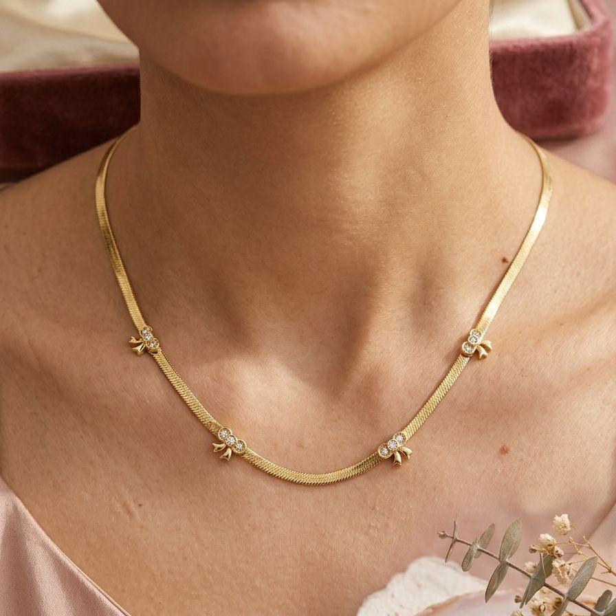 Gilded Bow Herringbone Necklace