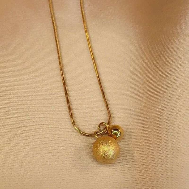 Golden ball pendent