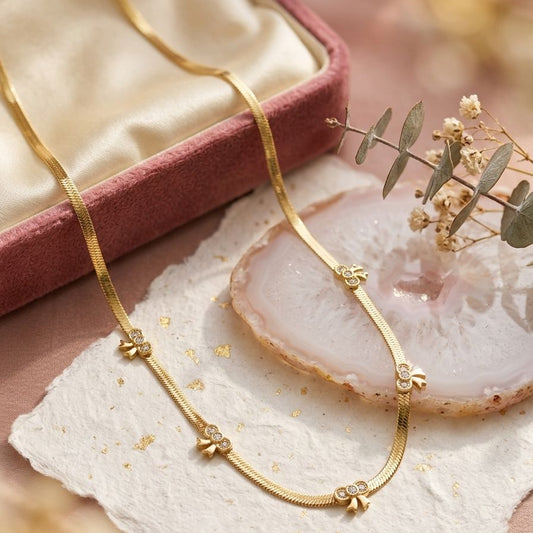 Gilded Bow Herringbone Necklace